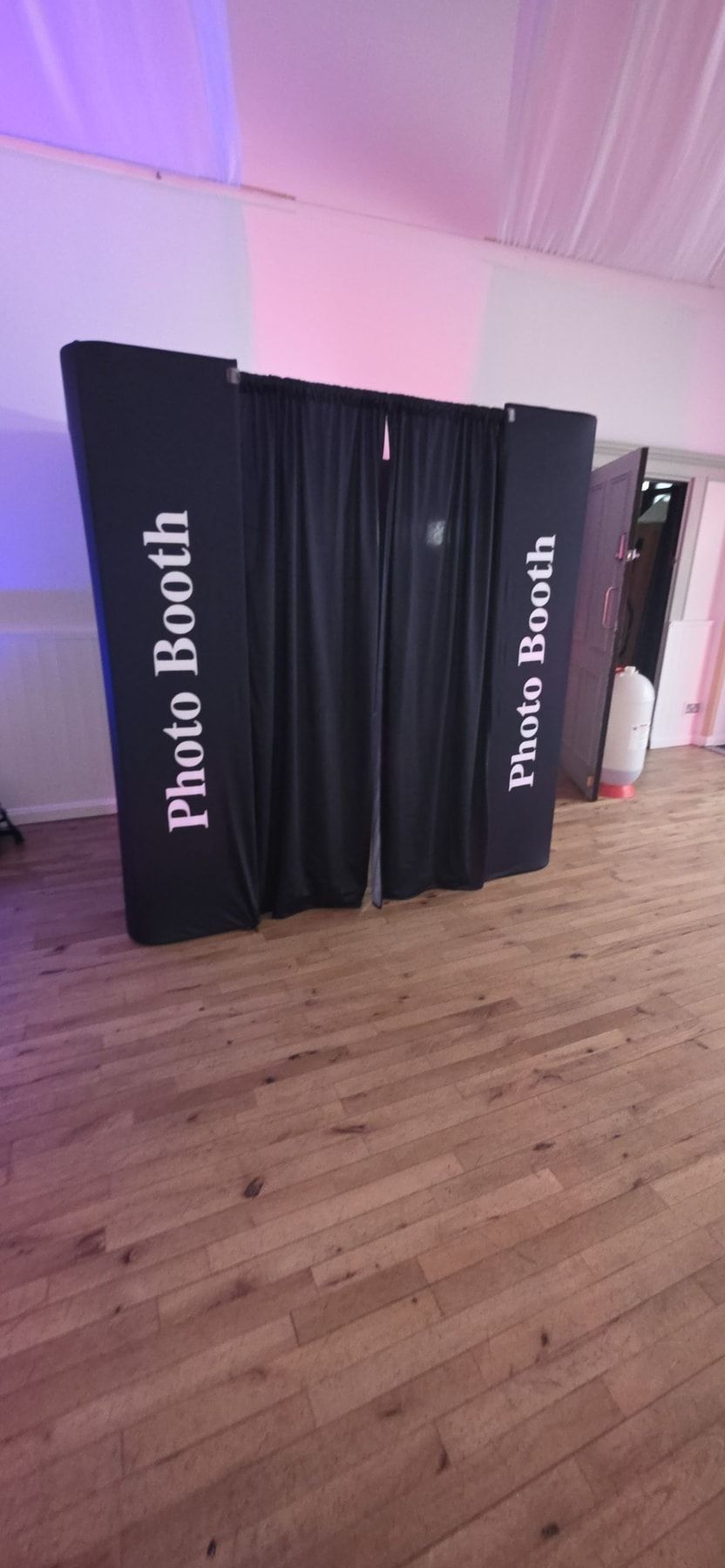 Party guests using a Surrey FaceBooth photo booth at Denbies Wine Estate