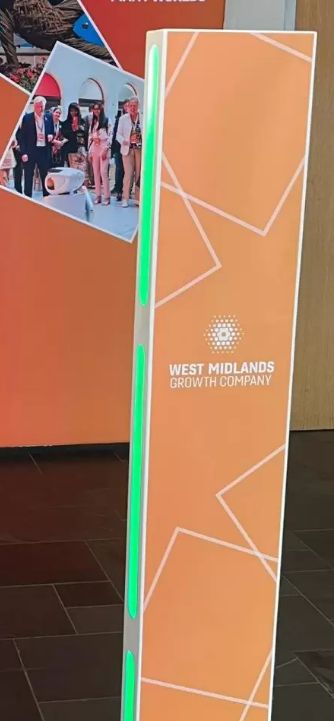 West Midlands Growth Company — orange floor-mounted totem booth at an event