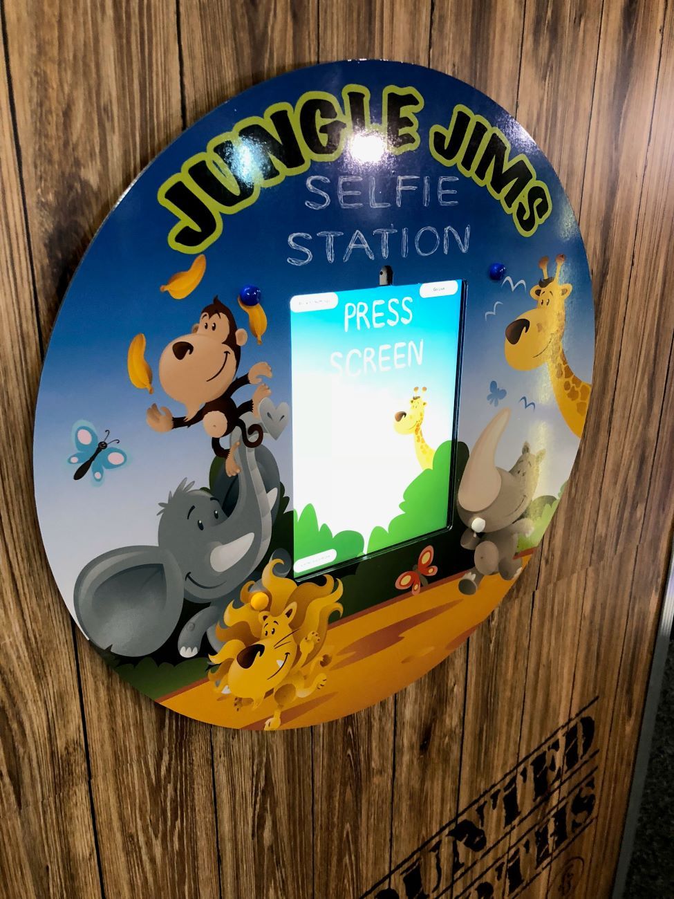 Jungle Jims — wall-mounted Selfie Station booth with jungle-themed branding for a family entertainment centre